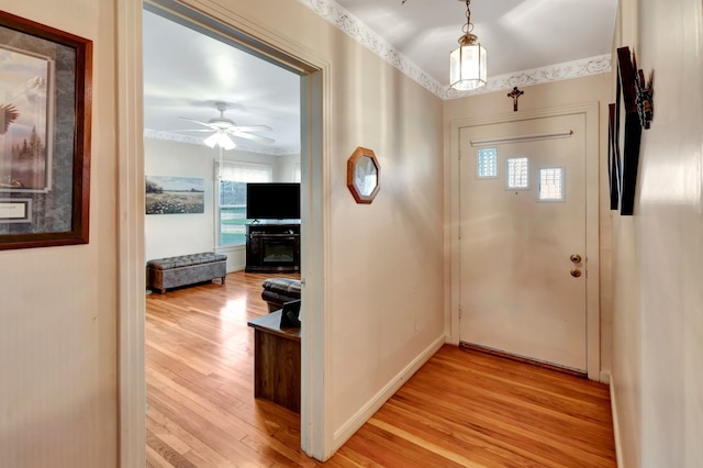 820 Meadow Ln, Wharton, TX 77488 - entryway featuring light wood-style flooring and ceiling fan