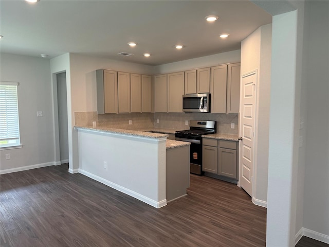 13305 Burbot Dr, Conroe, TX 77384 - kitchen with stainless steel appliances, gray cabinetry, dark wood finished floors, backsplash, and recessed lighting