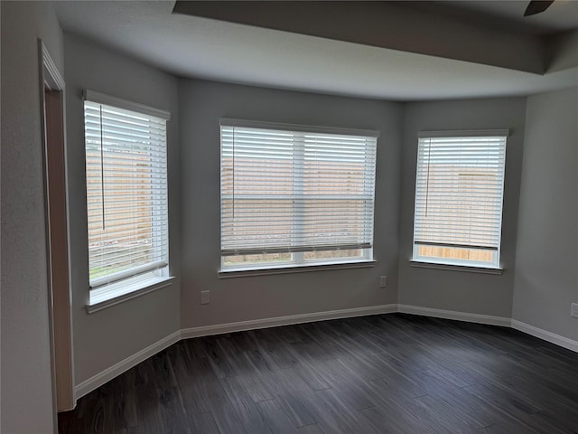 13305 Burbot Dr, Conroe, TX 77384 - unfurnished room with dark wood-type flooring and ceiling fan