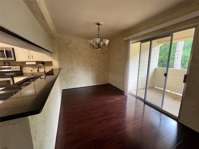 14515 Wunderlich Dr Unit 708, Houston, TX 77069 - unfurnished dining area with dark wood-style flooring and a chandelier