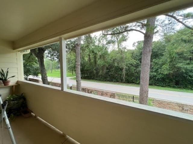 14515 Wunderlich Dr Unit 708, Houston, TX 77069 - unfurnished sunroom featuring view of wooded area
