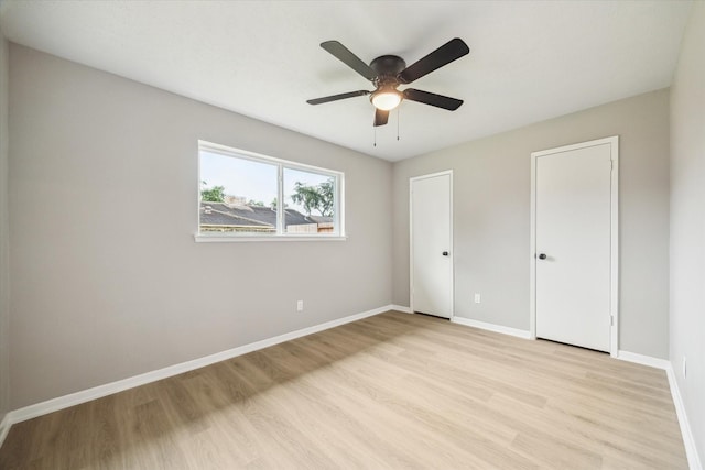 3114 Wagon Trail Dr, Sugar Land, TX 77479 - unfurnished bedroom featuring light wood finished floors and a ceiling fan