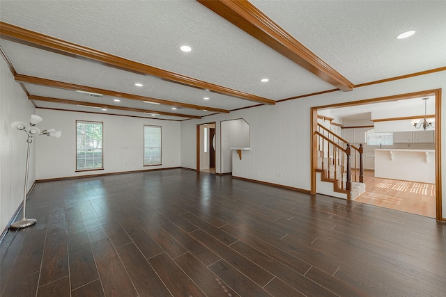 2510 Wind Fall Ln, Sugar Land, TX 77479 - unfurnished living room featuring a textured ceiling, beamed ceiling, wood finished floors, stairs, and recessed lighting