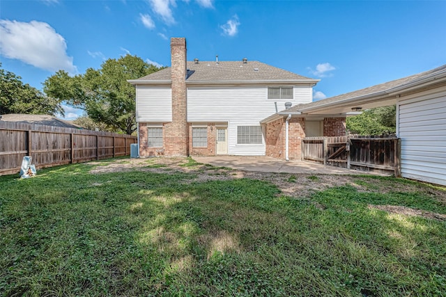 2510 Wind Fall Ln, Sugar Land, TX 77479 - back of house with brick siding, a fenced backyard, a chimney, and a patio
