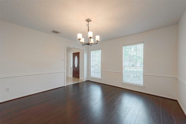 2510 Wind Fall Ln, Sugar Land, TX 77479 - spare room featuring a chandelier and wood finished floors