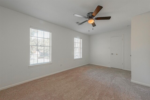 2510 Wind Fall Ln, Sugar Land, TX 77479 - empty room with light carpet and a ceiling fan