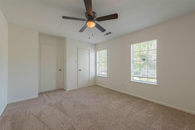 2510 Wind Fall Ln, Sugar Land, TX 77479 - unfurnished bedroom featuring light colored carpet and a ceiling fan
