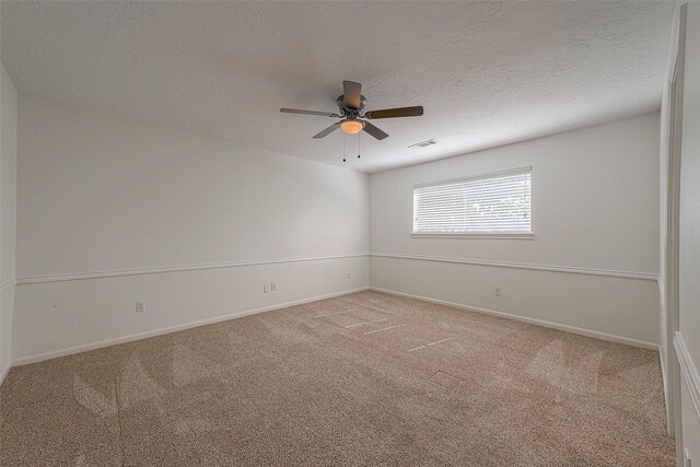2510 Wind Fall Ln, Sugar Land, TX 77479 - empty room featuring light carpet, ceiling fan, and a textured ceiling