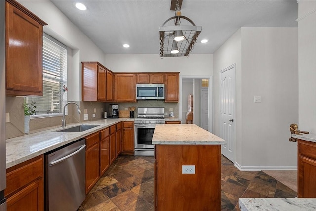 1427 Roaring Springs Ln, Seabrook, TX 77586 - kitchen with appliances with stainless steel finishes, stone tile floors, decorative backsplash, a kitchen island, and recessed lighting