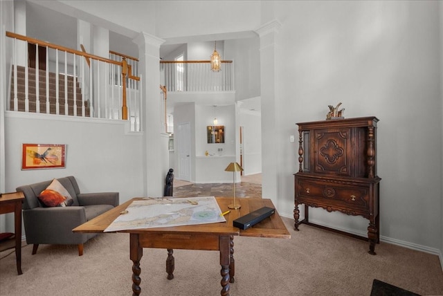 1427 Roaring Springs Ln, Seabrook, TX 77586 - carpeted living room featuring a high ceiling and decorative columns