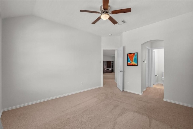 1427 Roaring Springs Ln, Seabrook, TX 77586 - empty room featuring arched walkways, a ceiling fan, and light colored carpet