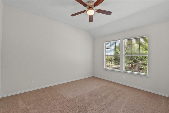 1427 Roaring Springs Ln, Seabrook, TX 77586 - spare room with light colored carpet, vaulted ceiling, and a ceiling fan