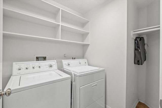 1427 Roaring Springs Ln, Seabrook, TX 77586 - laundry area with washer and clothes dryer and baseboards