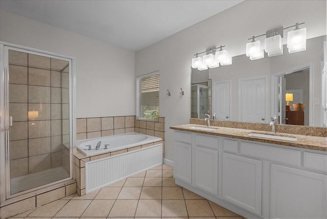 1427 Roaring Springs Ln, Seabrook, TX 77586 - bathroom featuring a shower stall, double vanity, a bath, and tile patterned flooring