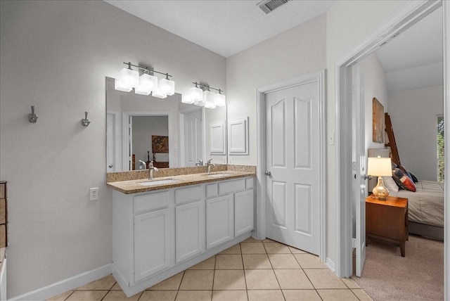 1427 Roaring Springs Ln, Seabrook, TX 77586 - ensuite bathroom with double vanity and tile patterned floors