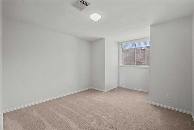 1427 Roaring Springs Ln, Seabrook, TX 77586 - carpeted spare room with baseboards and a textured ceiling