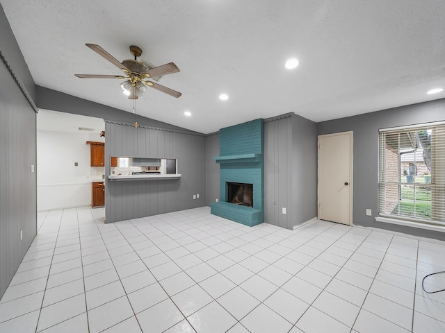 1406 Chippawa Ln, Pasadena, TX 77504 - unfurnished living room with lofted ceiling, ceiling fan, recessed lighting, and a large fireplace