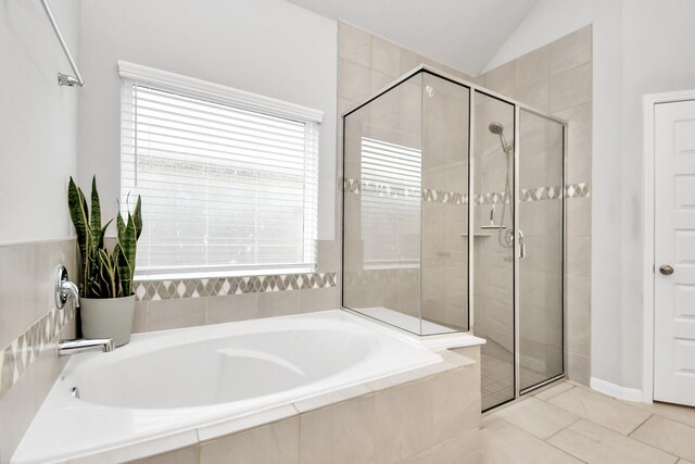 8419 Sunset Horizon Dr, Baytown, TX 77521 - bathroom with a bath, plenty of natural light, a stall shower, lofted ceiling, and tile patterned floors