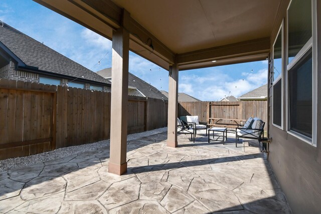 8419 Sunset Horizon Dr, Baytown, TX 77521 - fenced backyard with outdoor lounge area and a patio area