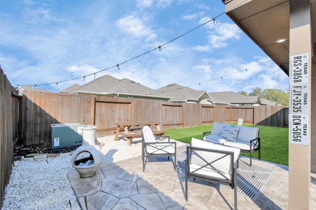 8419 Sunset Horizon Dr, Baytown, TX 77521 - fenced backyard featuring an outdoor hangout area and a patio