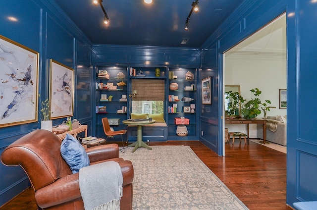 987 S Post Oak Ln, Houston, TX 77056 - living area featuring crown molding, rail lighting, and dark wood-style floors