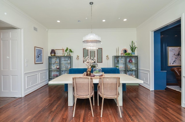 987 S Post Oak Ln, Houston, TX 77056 - dining space featuring a decorative wall, dark wood finished floors, crown molding, a chandelier, and a wainscoted wall
