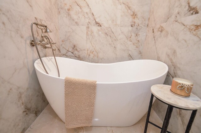 987 S Post Oak Ln, Houston, TX 77056 - bathroom view of tile walls and a soaking tub