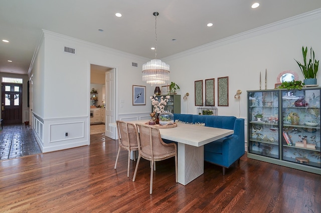 987 S Post Oak Ln, Houston, TX 77056 - dining space featuring crown molding, dark wood-type flooring, a chandelier, wainscoting, and breakfast area