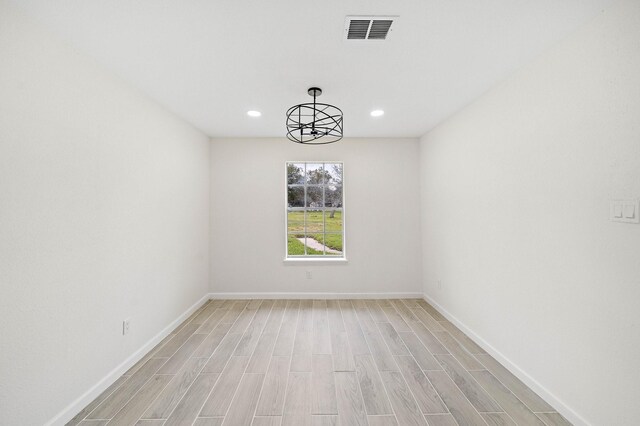 10219 Weldon Rd, Freeport, TX 77541 - spare room featuring light wood-style flooring and recessed lighting