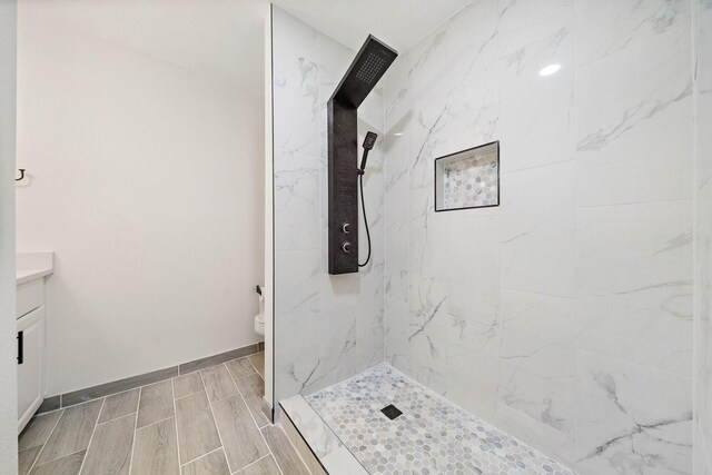 10219 Weldon Rd, Freeport, TX 77541 - bathroom with a marble finish shower, vanity, and wood finish floors