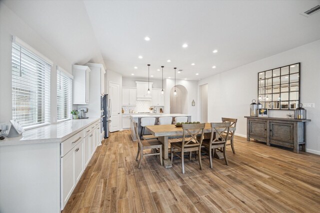 1523 Carson Field Ln, Richmond, TX 77469 - dining area with light wood finished floors, healthy amount of natural light, and recessed lighting