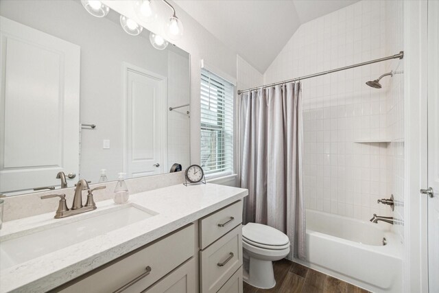 1523 Carson Field Ln, Richmond, TX 77469 - full bath featuring vaulted ceiling, vanity, wood finished floors, and shower / tub combo with curtain