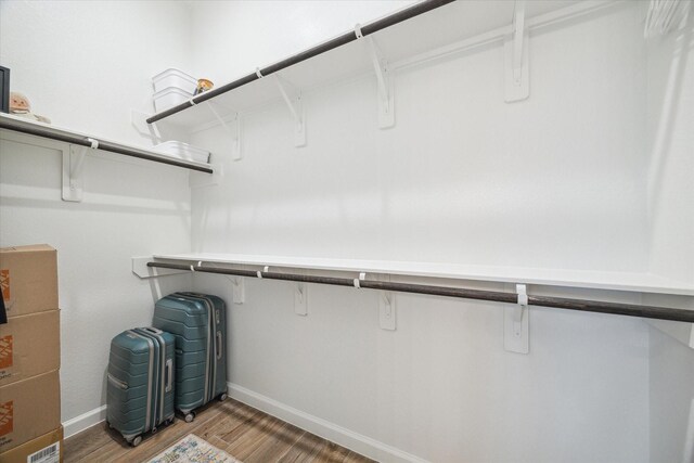 1523 Carson Field Ln, Richmond, TX 77469 - walk in closet featuring wood finished floors