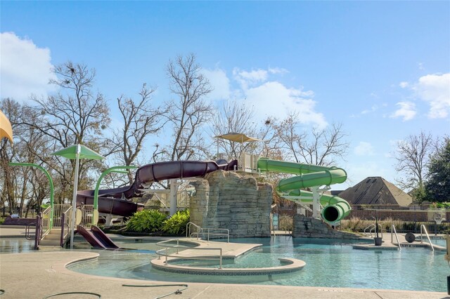 1523 Carson Field Ln, Richmond, TX 77469 - community pool with a water slide and a hot tub