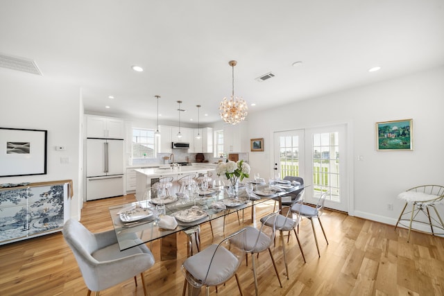 710 93rd St, Galveston, TX 77554 - dining room with recessed lighting, light wood-type flooring, a chandelier, and baseboards