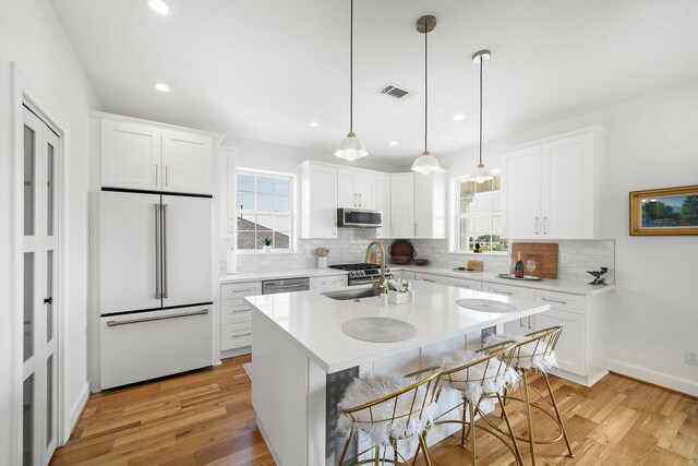 710 93rd St, Galveston, TX 77554 - kitchen featuring appliances with stainless steel finishes, decorative backsplash, light countertops, and recessed lighting