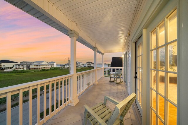 710 93rd St, Galveston, TX 77554 - deck at dusk with a residential view