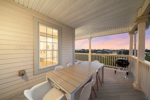 710 93rd St, Galveston, TX 77554 - deck at dusk featuring area for grilling and outdoor dining area