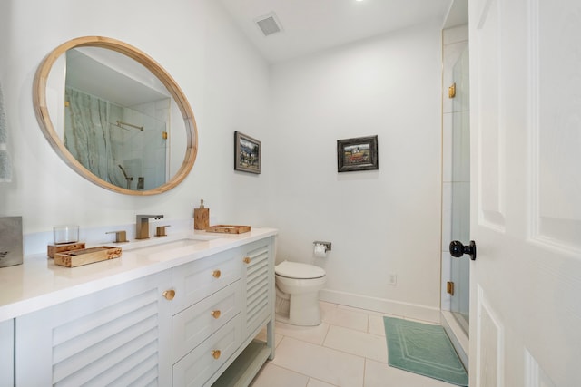710 93rd St, Galveston, TX 77554 - bathroom with toilet, vanity, tile patterned floors, and a stall shower