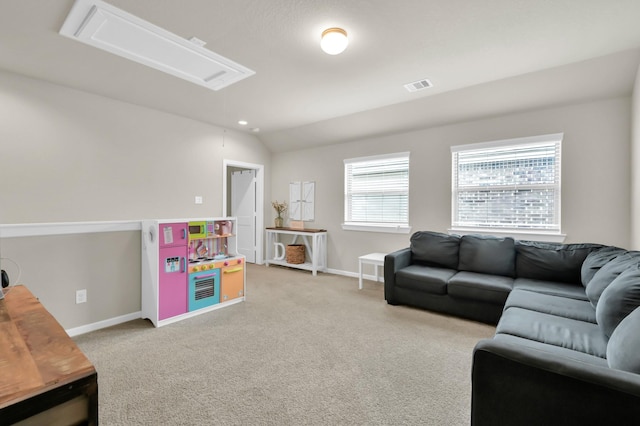 12330 Castano Creek Dr, Humble, TX 77346 - living room with attic access, light colored carpet, and vaulted ceiling