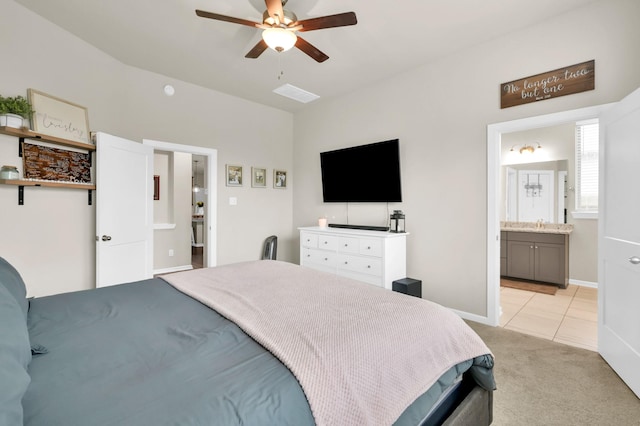 12330 Castano Creek Dr, Humble, TX 77346 - bedroom featuring light colored carpet, light tile patterned floors, connected bathroom, and a ceiling fan