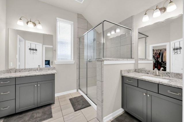 12330 Castano Creek Dr, Humble, TX 77346 - full bath featuring a stall shower, vanity, a walk in closet, and lofted ceiling
