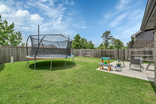 12330 Castano Creek Dr, Humble, TX 77346 - fenced backyard with a trampoline and a patio