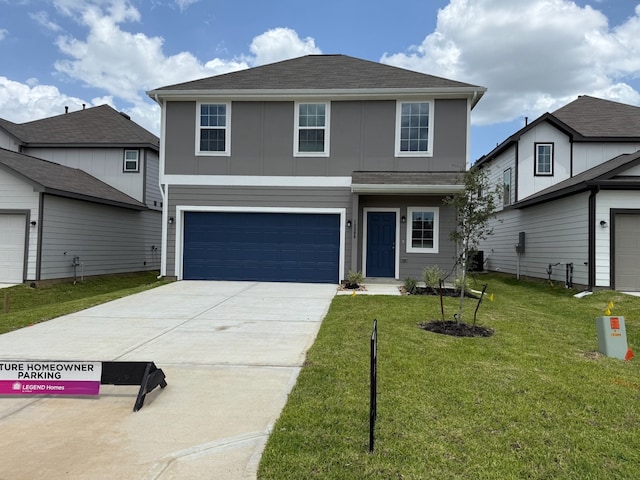 13308 Burbot Dr, Conroe, TX 77384 - traditional-style home featuring a garage, a front lawn, driveway, and roof with shingles