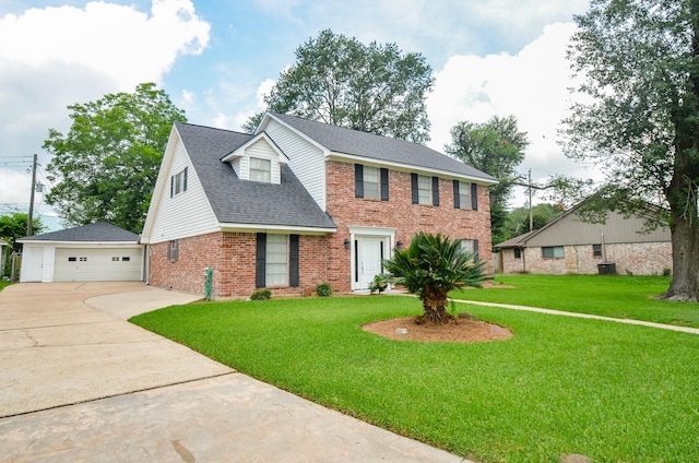 9719 Kindletree Dr, Houston, TX 77040 - colonial-style house with brick siding, a detached garage, a front lawn, and roof with shingles