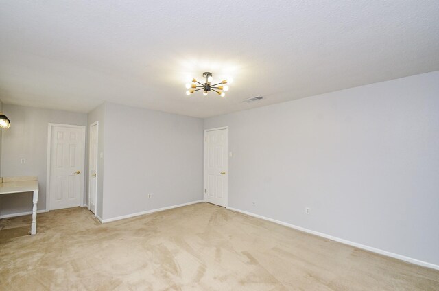 9719 Kindletree Dr, Houston, TX 77040 - unfurnished room with a chandelier and light carpet