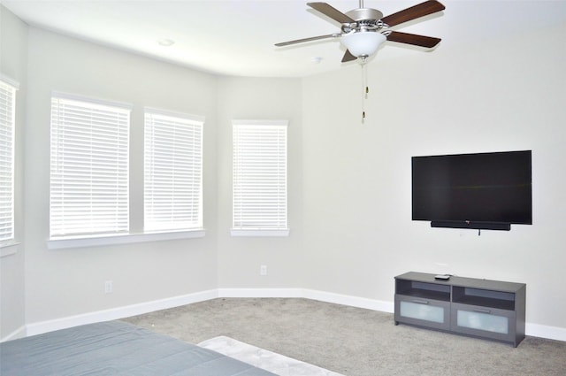 9323 Stablewood Lakes Ln, Tomball, TX 77375 - unfurnished living room featuring carpet flooring and a ceiling fan