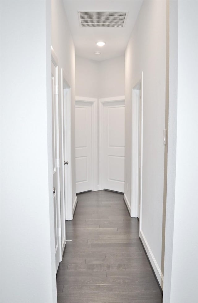 9323 Stablewood Lakes Ln, Tomball, TX 77375 - corridor with wood finished floors and baseboards
