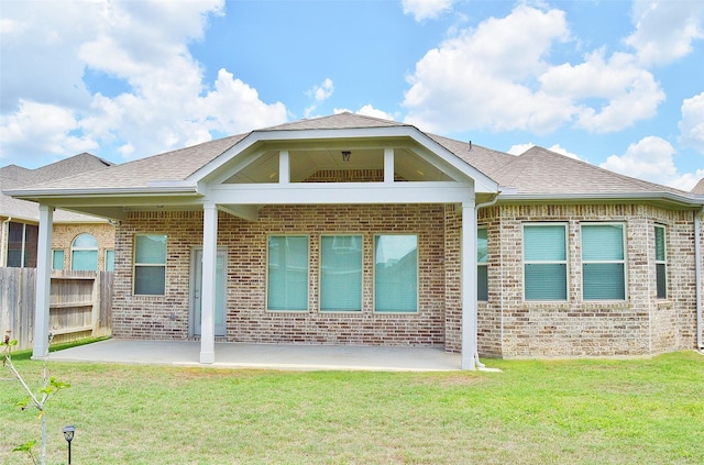 9323 Stablewood Lakes Ln, Tomball, TX 77375 - rear view of property featuring a patio, brick siding, and roof with shingles
