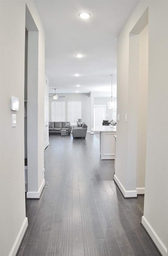 9323 Stablewood Lakes Ln, Tomball, TX 77375 - corridor with dark wood-style floors